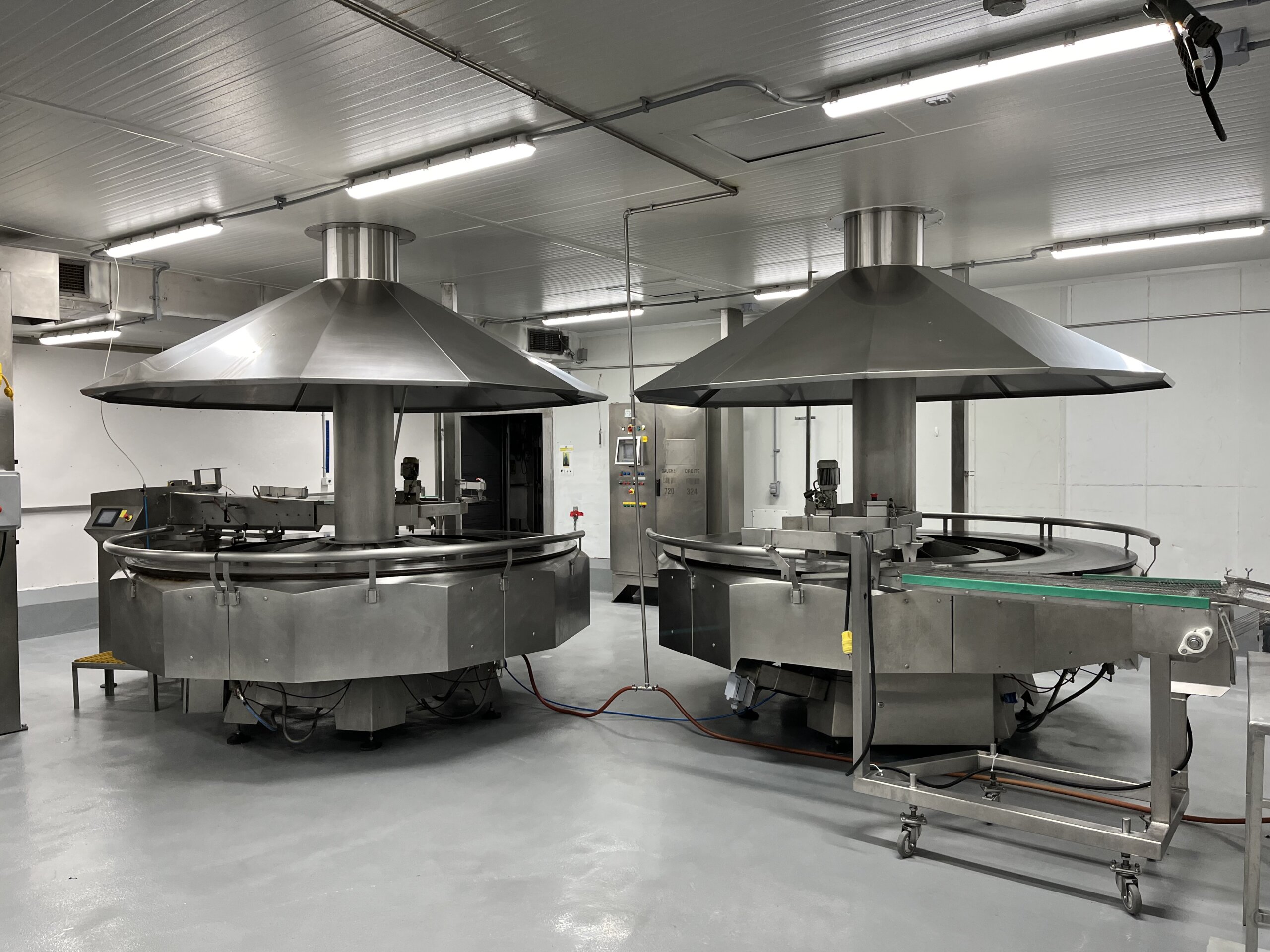 Heated rotary tables with integrated conveyors for efficient industrial crepe production from 6 to 13 inches.